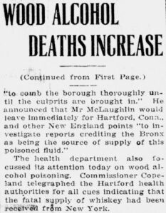 Old newspaper article with the headline, "Wood Alcohol Deaths Increase". Snippet of article briefly explains that an ongoing investigation into the source of poisoned whiskey has traced its origins to New York.